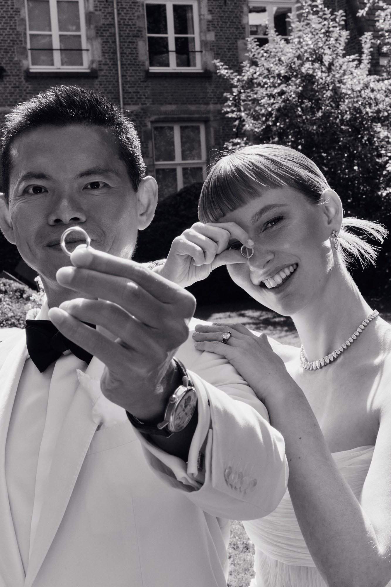 Lina and Jin showing their wedding rings
